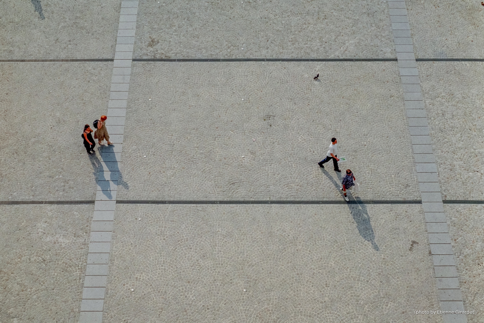 190002_plainpicture__dia115-people-walking-on-patterned-gray-pavement-by-E-Girardet.jpg
