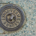 200405_vermessung_GT-manhole-cover-vermessungspunkt-by-E-Girardet.jpg