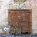 201212_29_IMG_3136-weathered-building-facade-with-wooden-door-by-E-Girardet.jpg