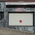 201607_23_DSC07596-graffiti-covered-building-with-cafe-sign-by-E-Girardet.jpg