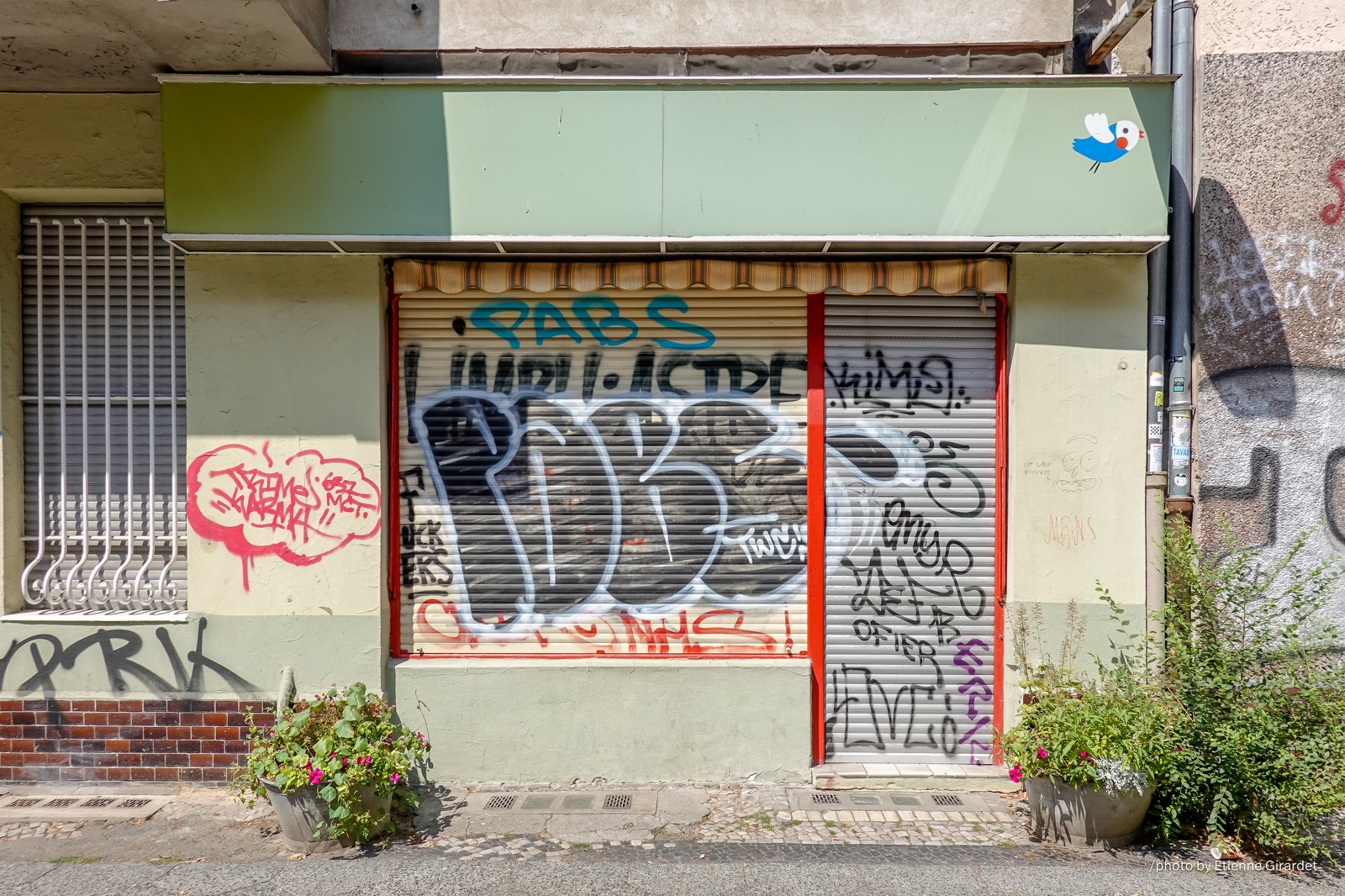 201807_20_RXX0250-graffiti-covered-storefront-facade-by-E-Girardet.jpg