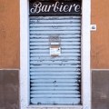 201910_03_RXX07740-closed-barbershop-sign-on-shuttered-shop-by-E-Girardet.jpg