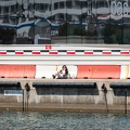 202204_14_RXX01251-person-sits-by-construction-barrier-by-water-by-E-Girardet.jpg