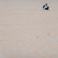 202302_03_RXX02625-woman-relaxing-on-sandy-beach-by-E-Girardet.jpg