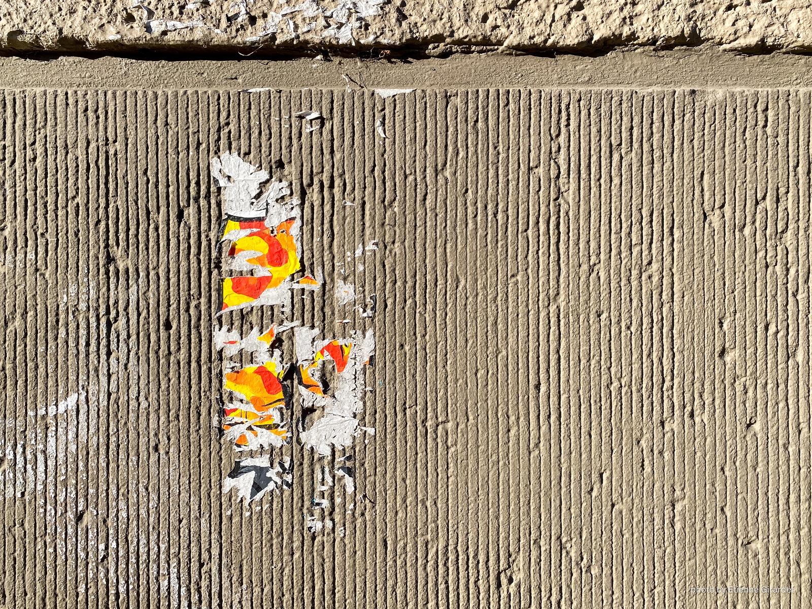 202301_19_IMG_4841-torn-poster-on-textured-wall-by-E-Girardet.jpg