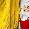 202312_03_IMG_9144-yellow-tarp-shop-sign-red-dress-mannequin-by-E-Girardet.jpg