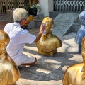 202312_08_IMG_9346-man-painting-golden-busts-outdoors-by-E-Girardet.jpg