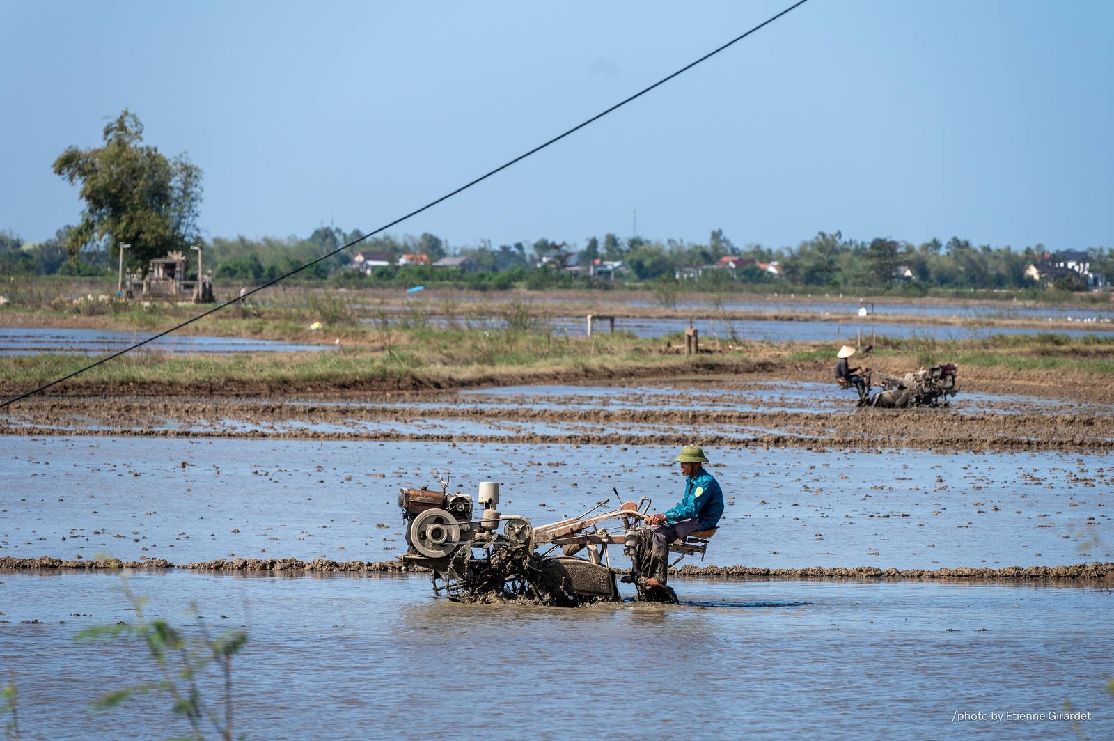 202401_08_ZZ64882-farmer-operates-small-tractor-in-flooded-rice-paddy-by-E-Girardet.jpg