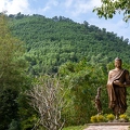 202401_09_ZZ64932-buddha-statue-in-lush-green-forest-by-E-Girardet.jpg