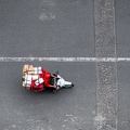 202401_28_ZZ65506-motorcyclist-carrying-packages-on-road-by-E-Girardet.jpg