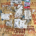 202402_03_IMG_3407-online-ads-and-numbers-plastered-on-wall-by-E-Girardet.jpg